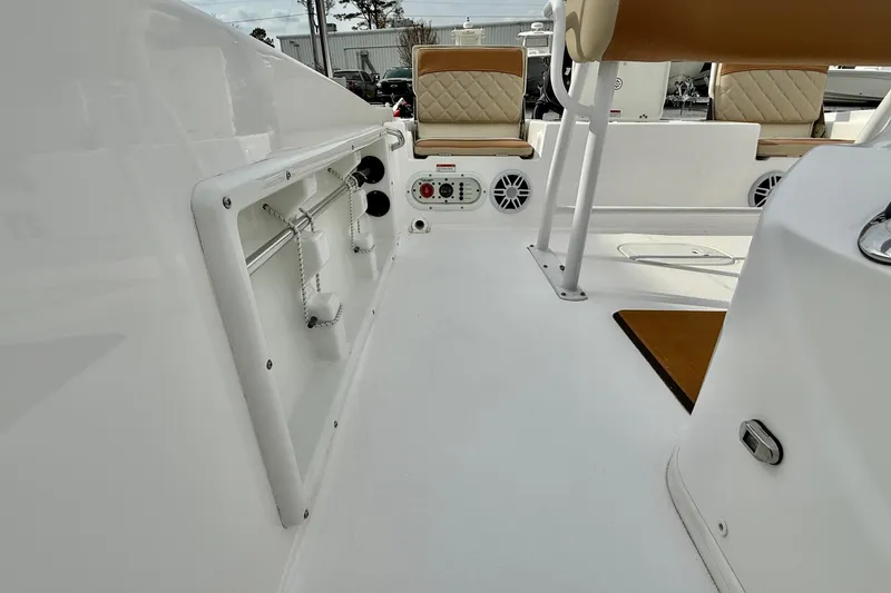 Slide: The Image of 2025 NauticStar 191 Hybrid boat interior with seating and control panel. - 11