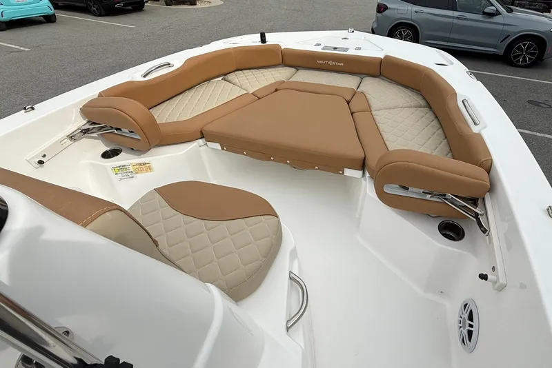 Slide: The Image of 2025 NauticStar 191 Hybrid boat interior with tan cushioned seating. - 16
