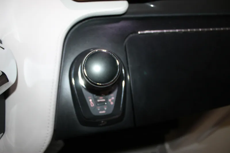 Slide: The Image of Control panel of 2022 Tiara Yachts 43 LS, featuring a sleek joystick interface. - 17