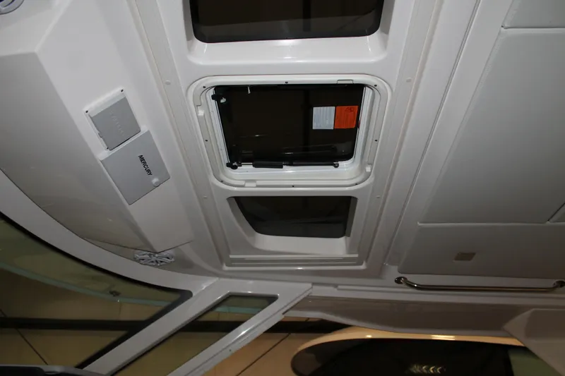 Slide: The Image of Ceiling view of 2022 Tiara Yachts 43 LS with open hatch and Mercury panel. - 20