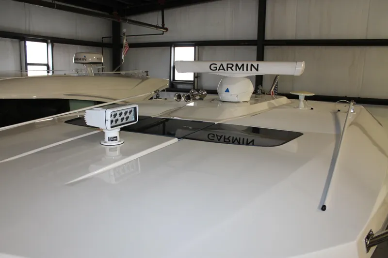 Slide: The Image of 2022 Tiara Yachts 43 LS with Garmin radar and spotlight on deck. - 21