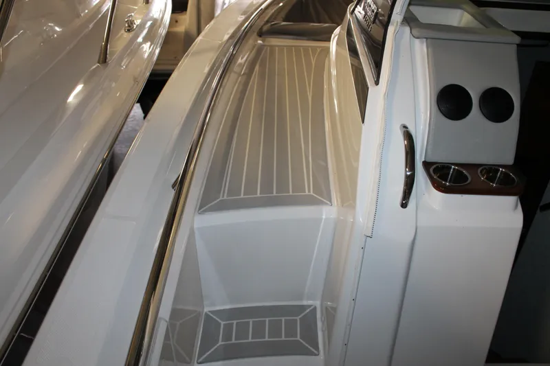 Slide: The Image of 2022 Tiara Yachts 43 LS boat interior with sleek design and cup holders. - 22
