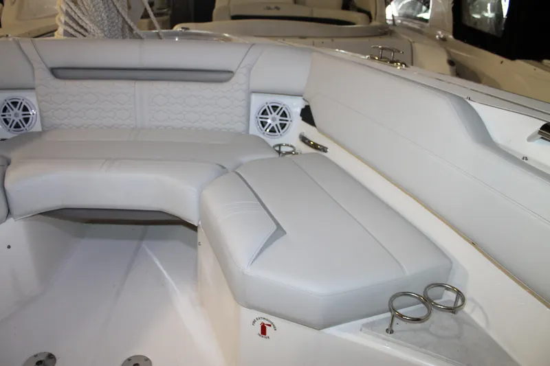 Slide: The Image of Luxurious seating area on 2022 Tiara Yachts 43 LS with cup holders and speakers. - 25