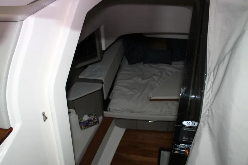 Slide: The Image of Interior cabin of 2022 Tiara Yachts 43 LS, featuring a cozy bed and modern design. - 29
