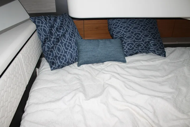 Slide: The Image of Interior cabin of 2022 Tiara Yachts 43 LS with blue patterned pillows. - 31