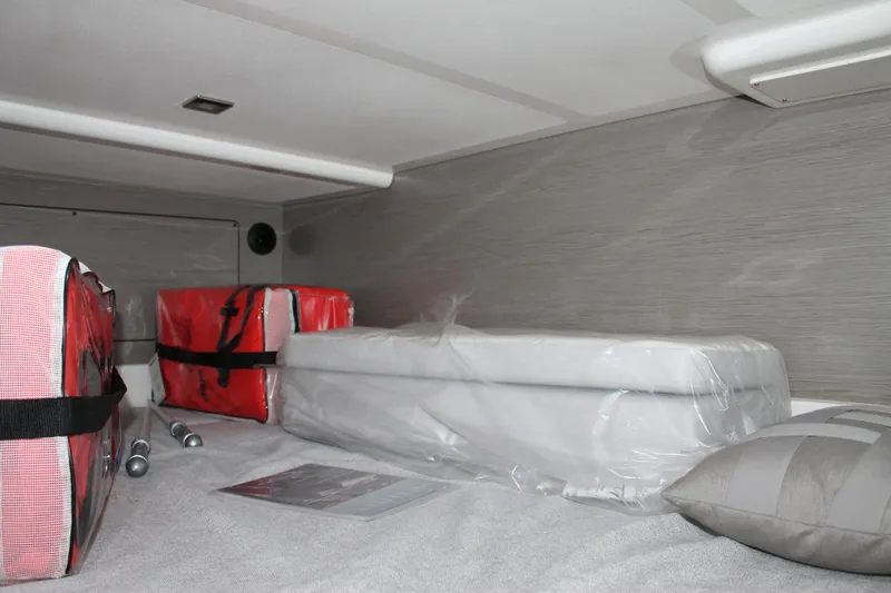 Slide: The Image of Interior cabin of 2022 Tiara Yachts 43 LS with storage and cushions. - 34