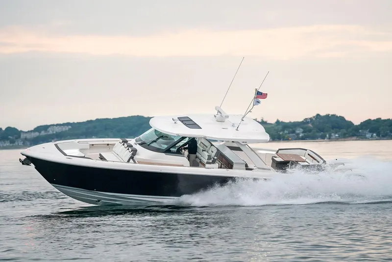 Slide: The Image of Manufacturer Provided Image: 2022 Tiara Yachts 43 LS cruising on water at sunset. - 36