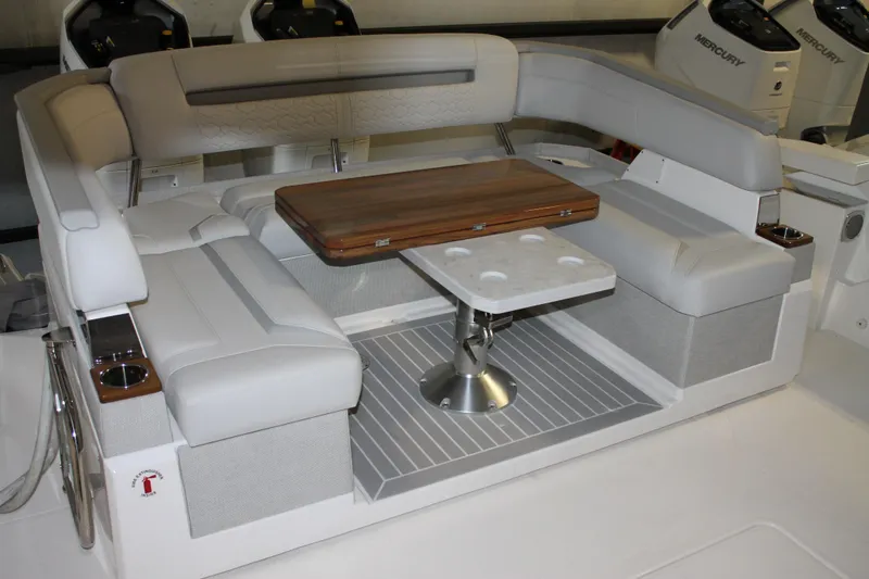 Slide: The Image of Luxurious seating area on 2022 Tiara Yachts 43 LS with elegant table setup. - 5