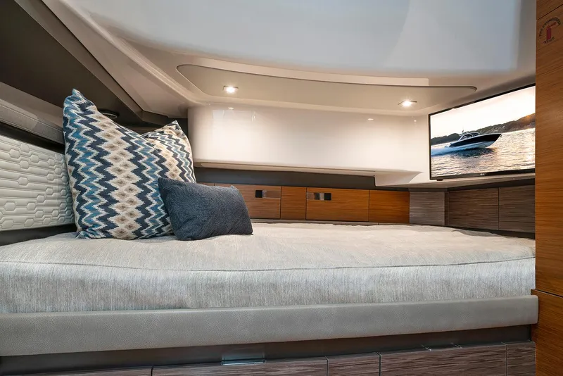 Slide: The Image of Manufacturer Provided Image: Luxurious cabin interior of 2022 Tiara Yachts 43 LS with modern bedding and TV. - 52
