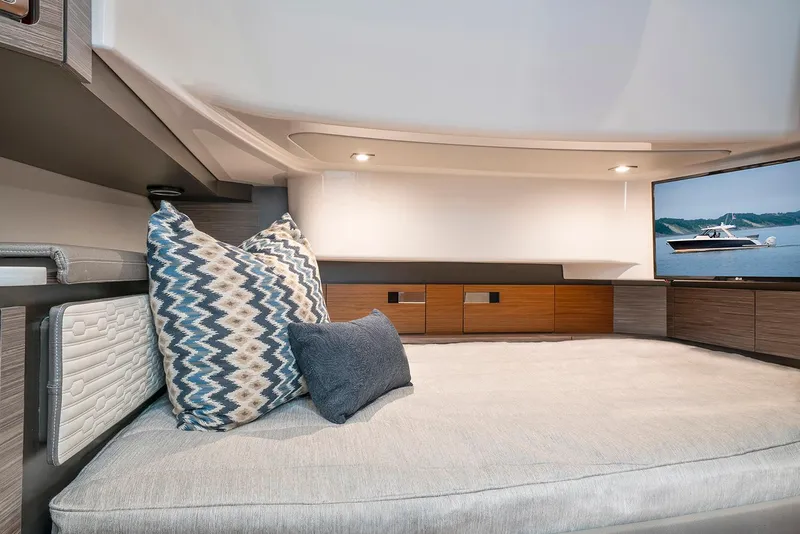 Slide: The Image of Manufacturer Provided Image: 2022 Tiara Yachts 43 LS interior cabin with bed, pillows, and TV. - 53
