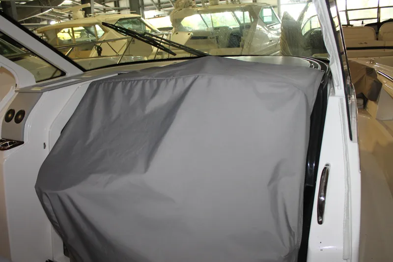 Slide: The Image of 2022 Tiara Yachts 43 LS helm covered with a protective gray cover. - 61