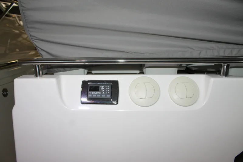 Slide: The Image of 2022 Tiara Yachts 43 LS interior with Dometic control panel and air vents. - 63