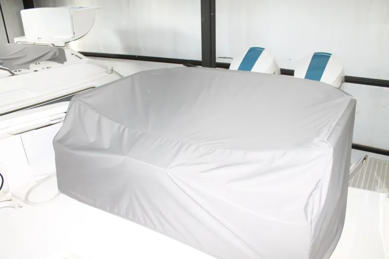 Slide: The Image of 2022 Tiara Yachts 43 LS with covered seating area and dual engines. - 65