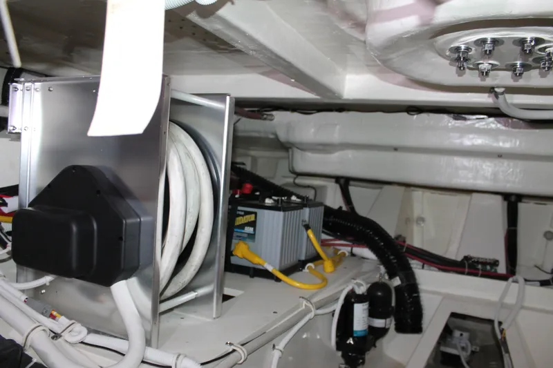 Slide: The Image of Engine room of 2022 Tiara Yachts 43 LS, showcasing wiring and equipment. - 67