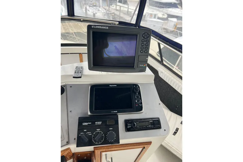 Slide: The Image of Control panel of 1988 Carver 3807 Aft Cabin Motor Yacht with navigation equipment. - 26