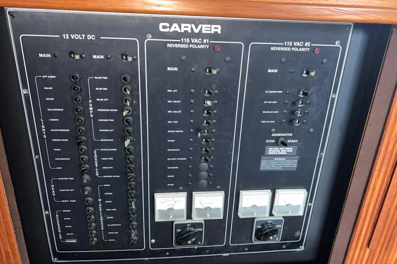 Slide: The Image of Control panel of 1988 Carver 3807 Aft Cabin Motor Yacht, featuring electrical switches and gauges. - 11