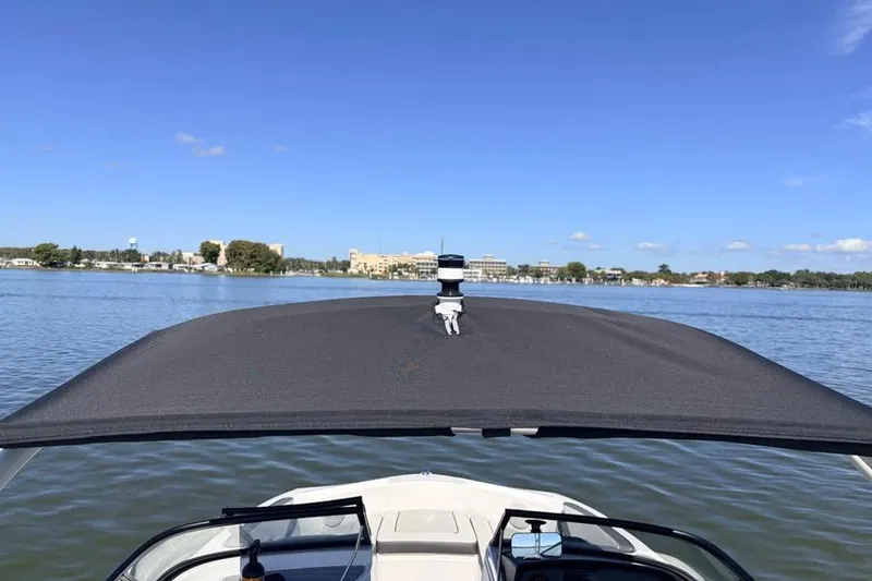 Slide: The Image of 2024 Yamaha Boats AR190 on calm water with clear blue sky. - 3