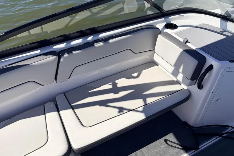 Slide: The Image of 2024 Yamaha Boats AR190 interior seating with sleek design and comfortable cushions. - 6