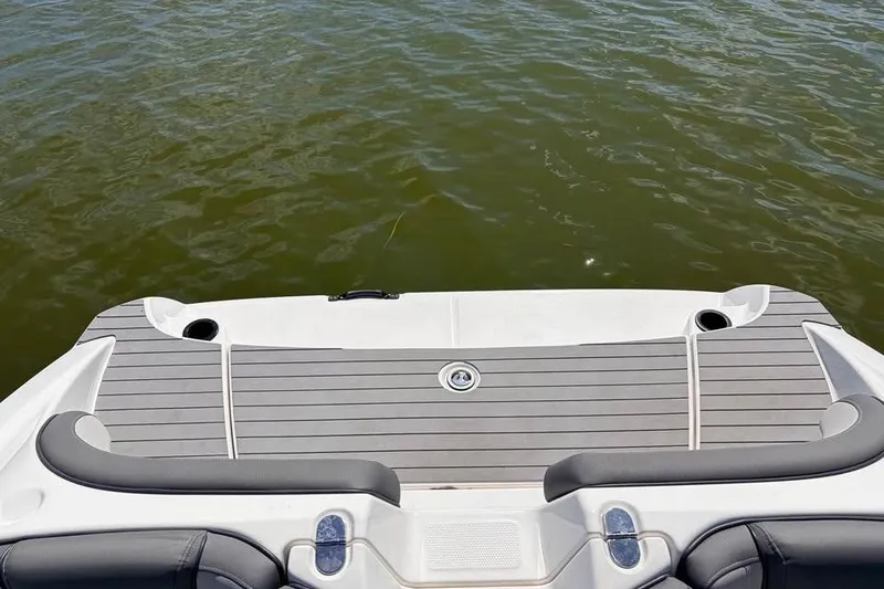 Slide: The Image of 2024 Yamaha Boats AR190 swim platform on calm water. - 7