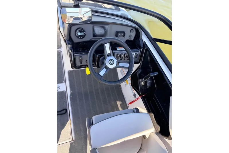 Slide: The Image of 2024 Yamaha Boats AR190 cockpit with steering wheel and dashboard controls. - 8