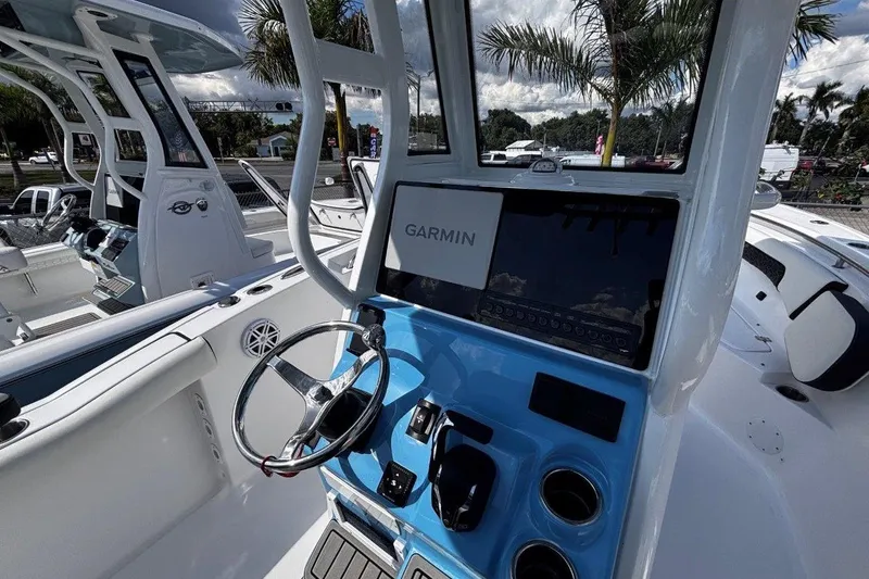 Slide: The Image of 2026 Tidewater 232 CC Adventure boat dashboard with Garmin navigation system. - 17