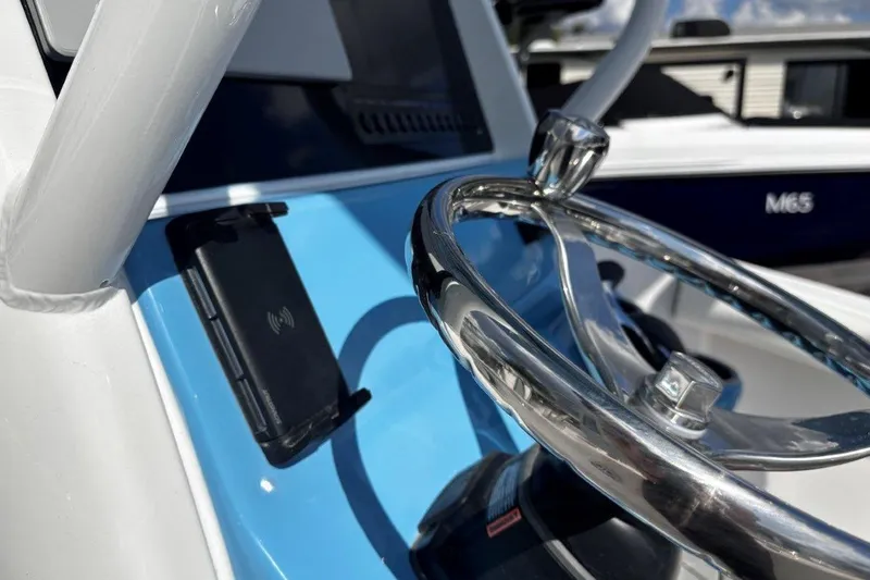 Slide: The Image of Steering wheel of 2026 Tidewater 232 CC Adventure boat, featuring sleek design and modern controls. - 20