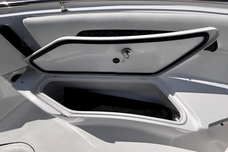 Slide: The Image of Open storage compartment on 2026 Tidewater 232 CC Adventure boat. - 25