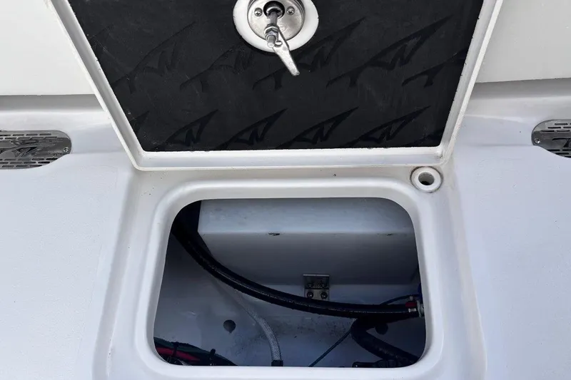 Slide: The Image of Open storage compartment on 2026 Tidewater 232 CC Adventure boat. - 27