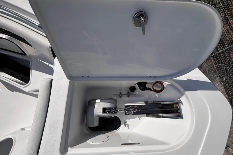 Slide: The Image of Open storage compartment on 2026 Tidewater 232 CC Adventure boat, showcasing interior features. - 30