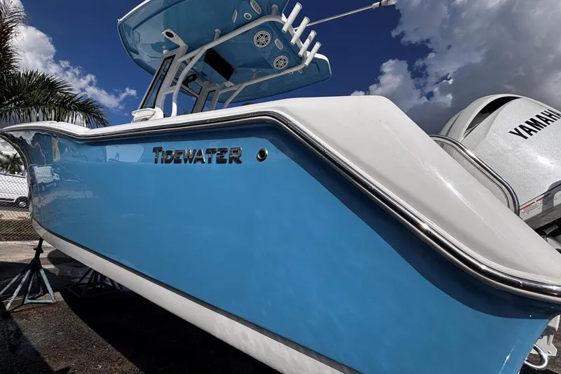 Slide: The Image of 2026 Tidewater 232 CC Adventure boat with Yamaha engine, blue hull, sunny day. - 5