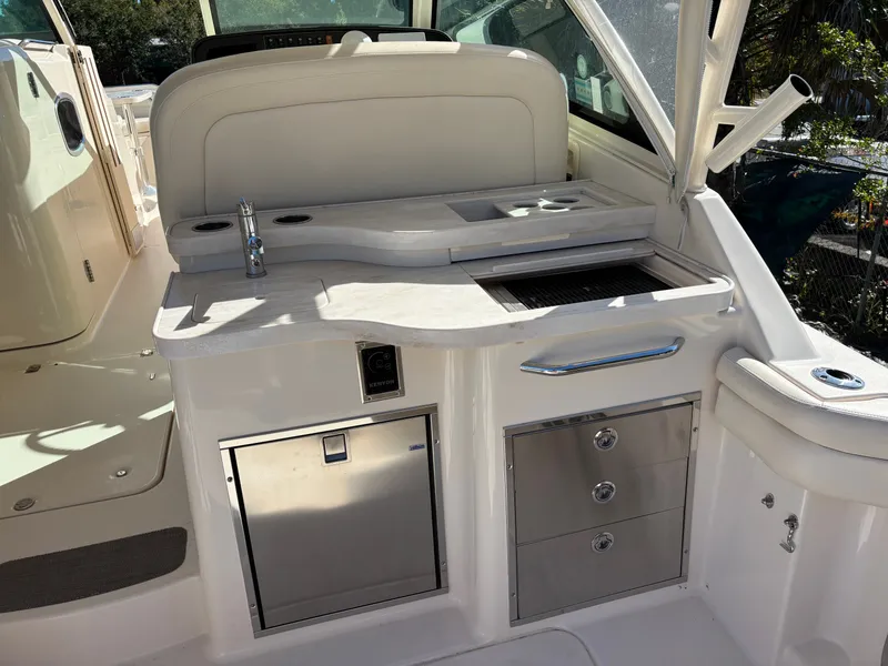 Slide: The Image of 2019 Grady-White Freedom 375 boat interior with kitchenette and storage drawers. - 11