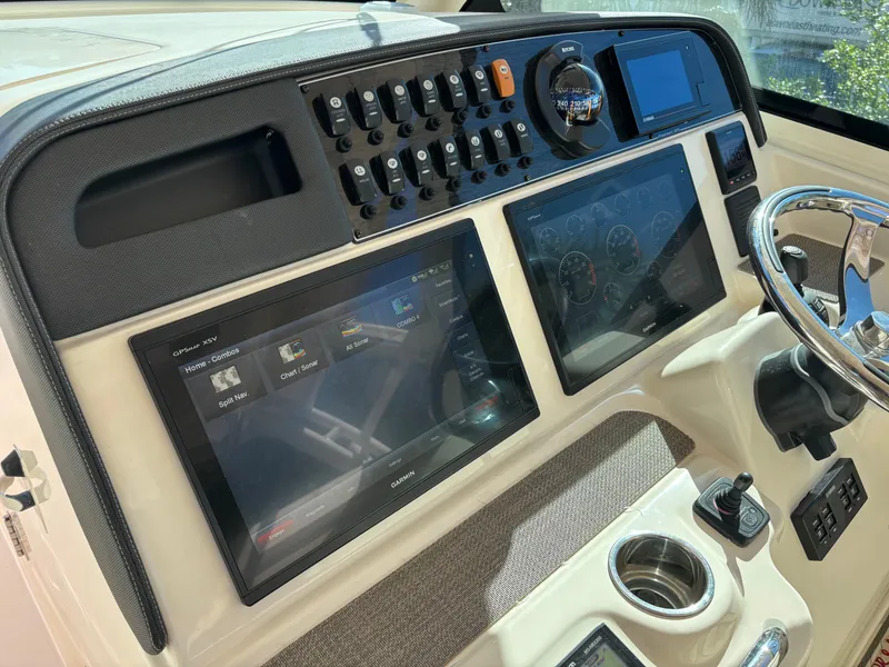Slide: The Image of Control panel of 2019 Grady-White Freedom 375 boat with advanced navigation displays. - 15