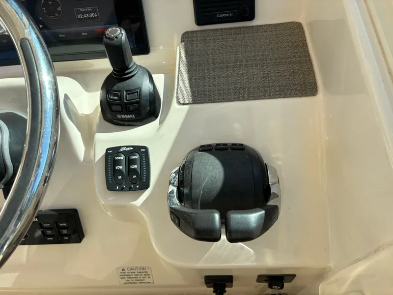 Slide: The Image of Control panel of 2019 Grady-White Freedom 375 boat with Yamaha joystick and Garmin display. - 19