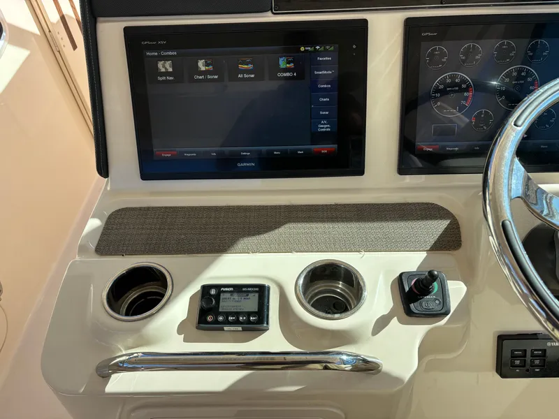 Slide: The Image of 2019 Grady-White Freedom 375 dashboard with Garmin displays and controls. - 20