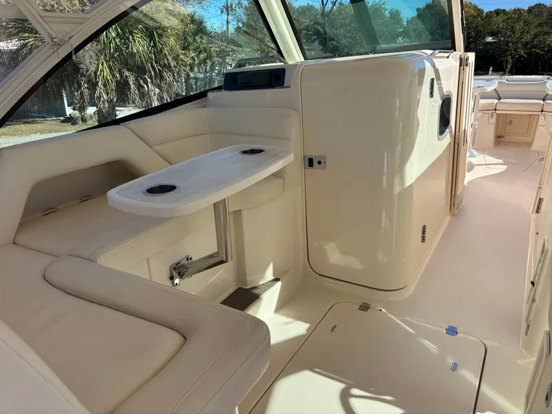 Slide: The Image of 2019 Grady-White Freedom 375 boat interior with seating and table. - 22