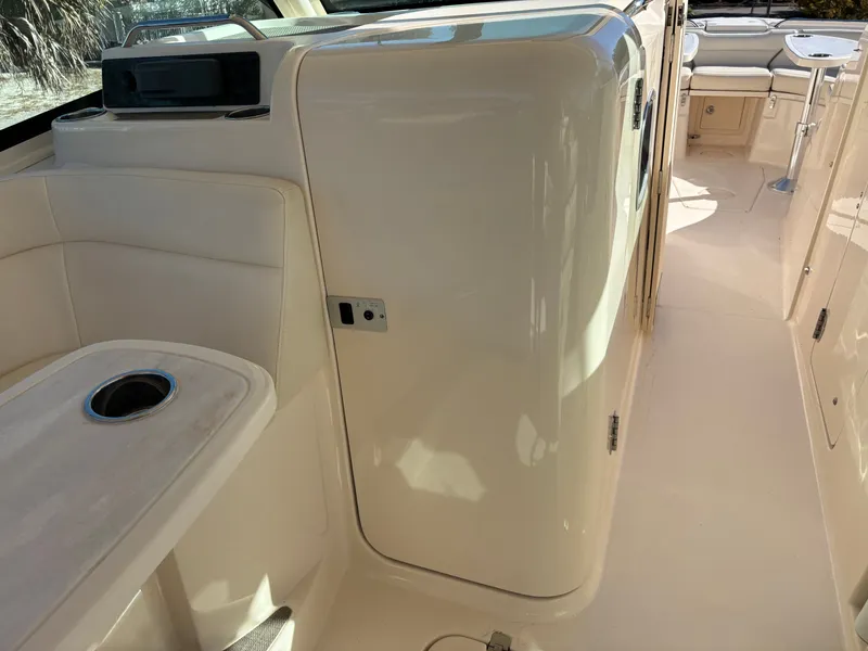 Slide: The Image of 2019 Grady-White Freedom 375 boat interior with seating and table. - 24