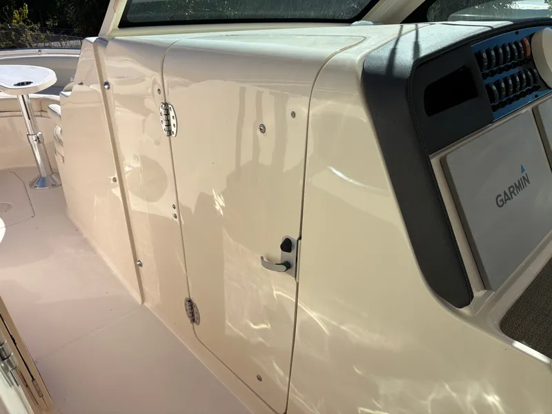 Slide: The Image of 2019 Grady-White Freedom 375 boat interior with Garmin navigation system. - 27