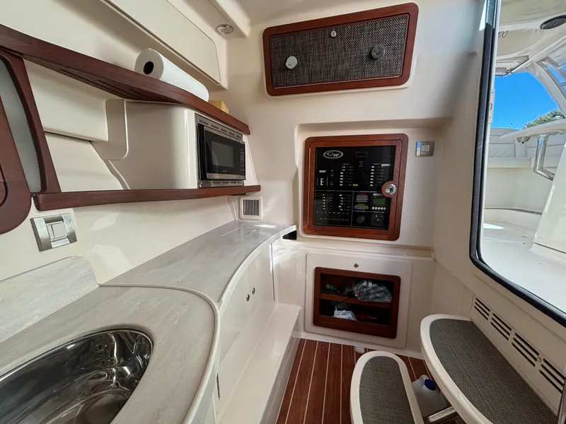 Slide: The Image of 2019 Grady-White Freedom 375 interior with kitchenette and control panel. - 30