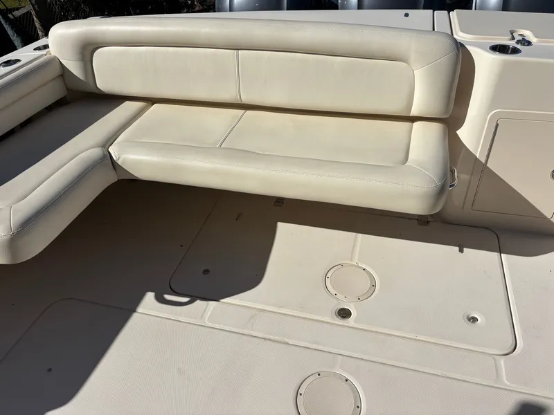 Slide: The Image of 2019 Grady-White Freedom 375 boat interior with beige seating and deck. - 31