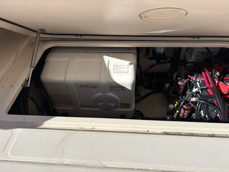 Slide: The Image of Engine compartment of a 2019 Grady-White Freedom 375 boat, showing generator and wiring. - 32