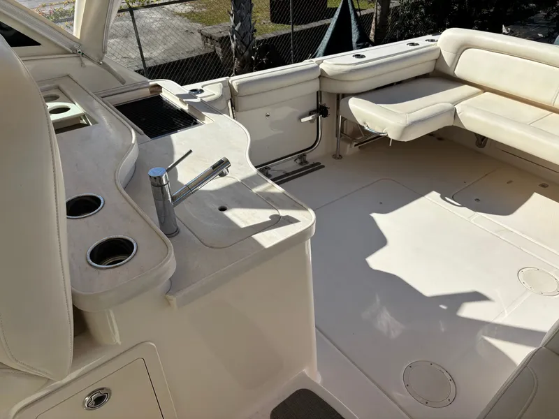 Slide: The Image of 2019 Grady-White Freedom 375 boat interior with seating and kitchenette area. - 33
