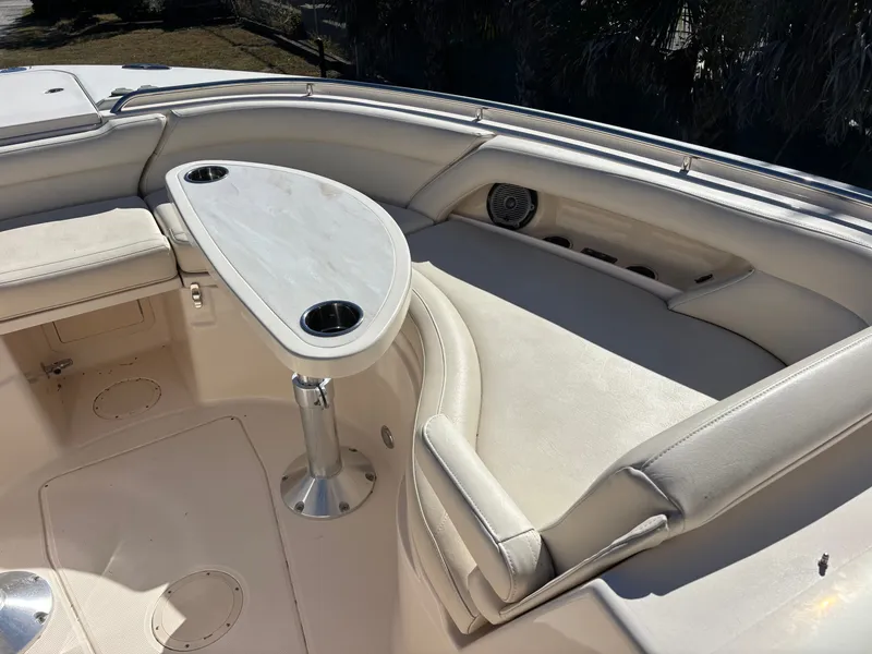 Slide: The Image of 2019 Grady-White Freedom 375 boat interior with cushioned seating and table. - 7