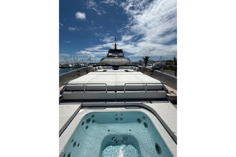 Slide: The Image of Luxury 2025 Riva 130' Bellissima yacht on serene blue waters. - 12