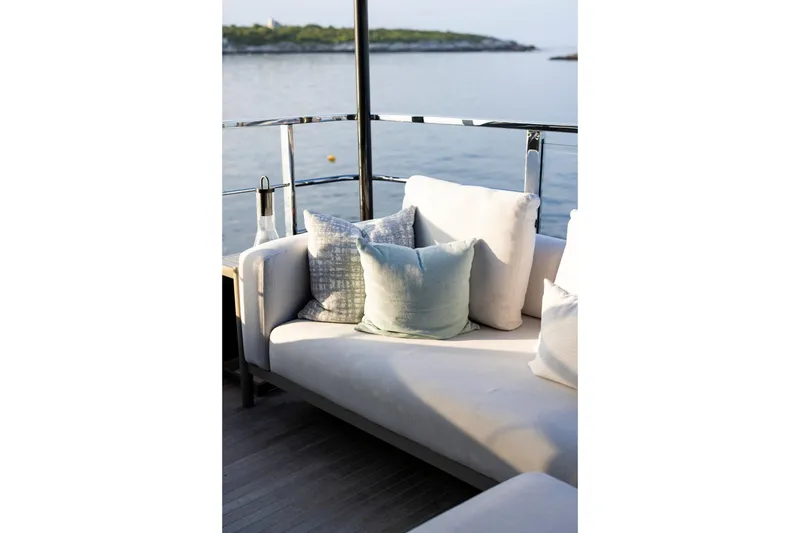 Slide: The Image of Luxury yacht Riva 130' Bellissima 2025 on open water, city skyline in background. - 18