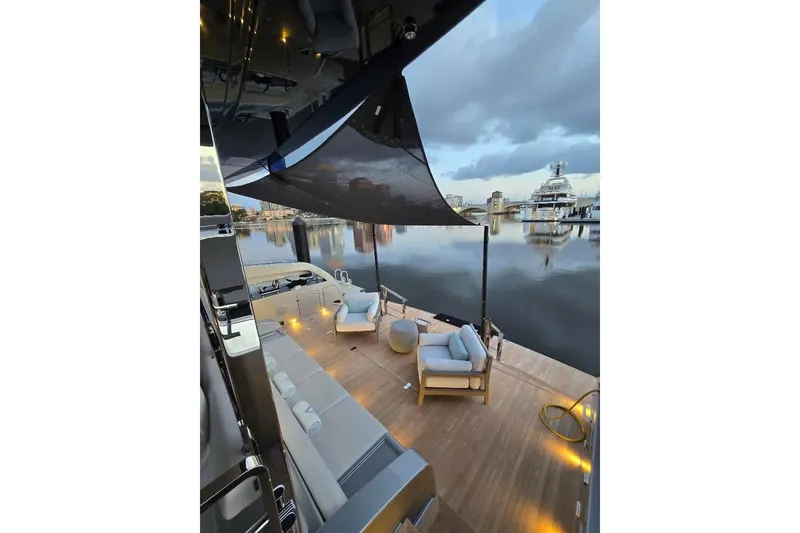 Slide: The Image of Luxurious deck of 2025 Riva 130' Bellissima yacht with elegant seating and ocean view. - 21
