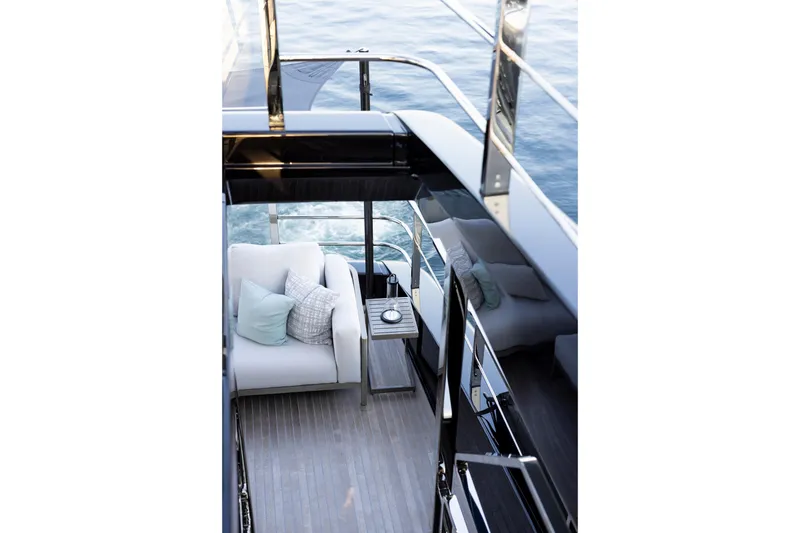 Slide: The Image of Luxurious deck of 2025 Riva 130' Bellissima yacht with ocean view and plush seating. - 24