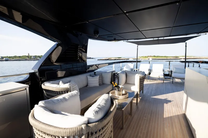 Slide: The Image of Luxurious 2025 Riva 130' Bellissima yacht deck with elegant seating and ocean view. - 28