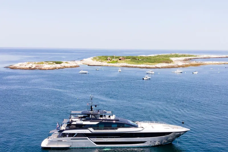 Slide: The Image of Luxurious 2025 Riva 130' Bellissima yacht cruising on clear blue waters. - 3