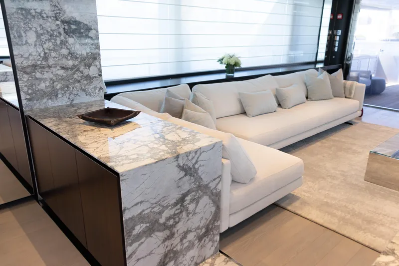 Slide: The Image of Luxurious deck of 2025 Riva 130' Bellissima yacht with elegant seating and ocean view. - 31