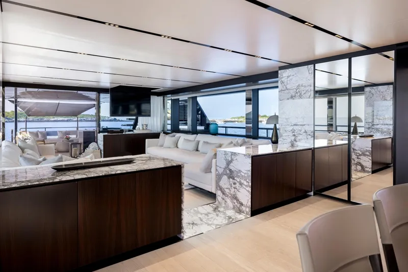 Slide: The Image of Luxurious 2025 Riva 130' Bellissima yacht with elegant outdoor seating and "Tenacious" nameplate. - 32